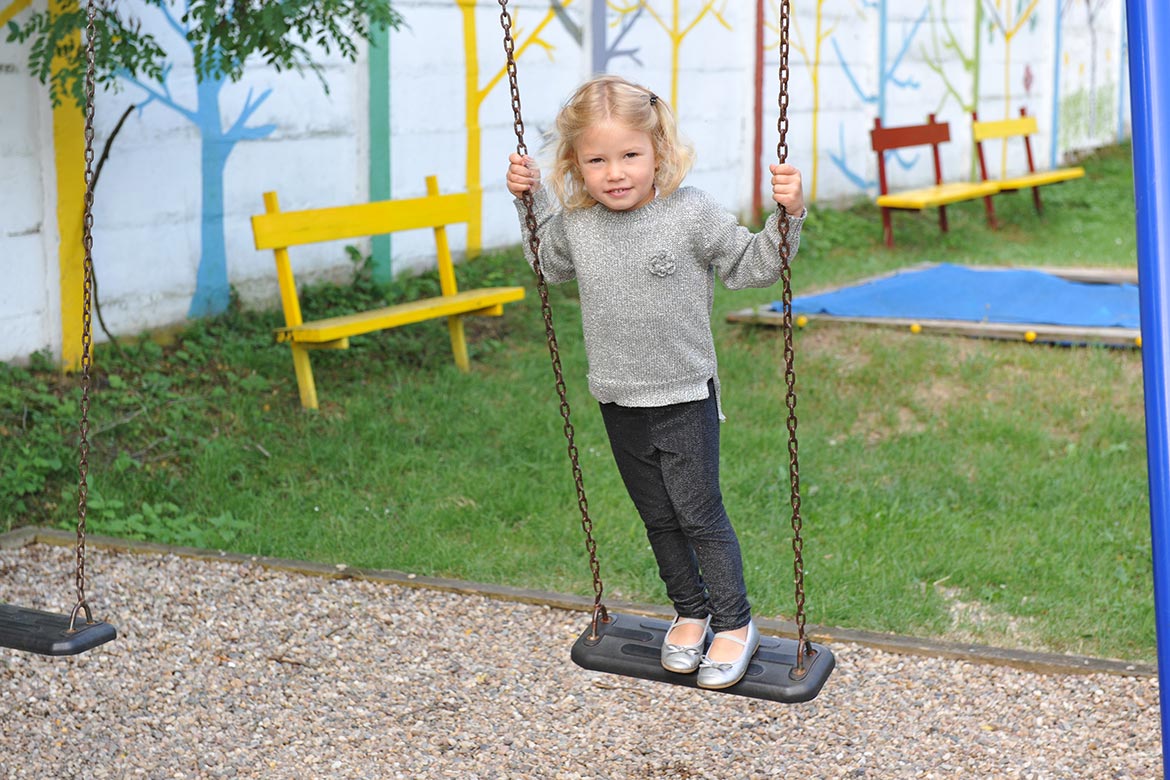 Little girl on swing at SKP Hopo facility