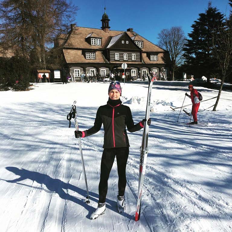 Emily Prucha standing in front of lodge in Jizera Mountains